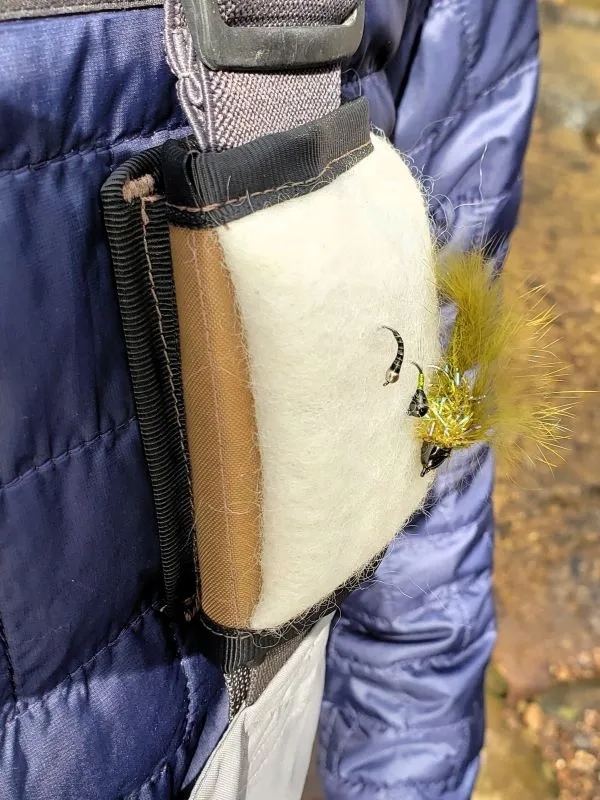 The Versa Fly Patch attached to fishing wader suspenders.