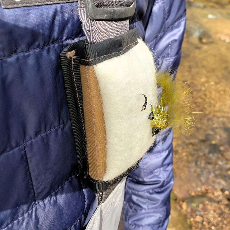The Versa fly patch attached to fishing wader suspenders