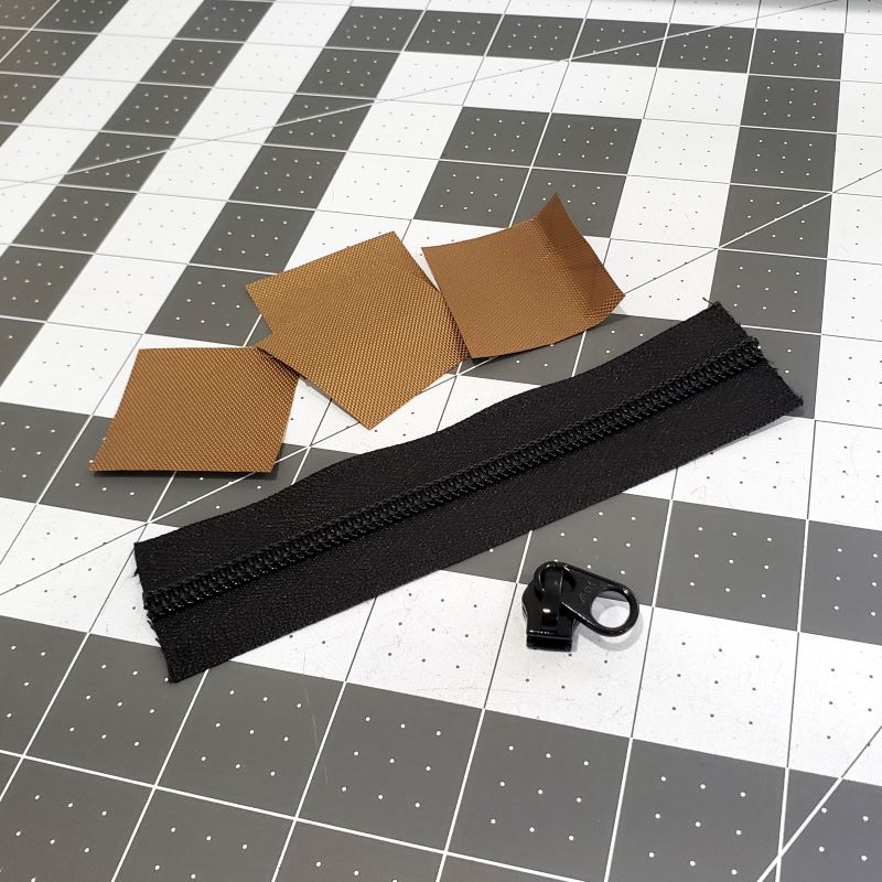 Zipper components ready for assembly.