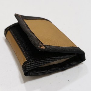A fly wallet folded closed
