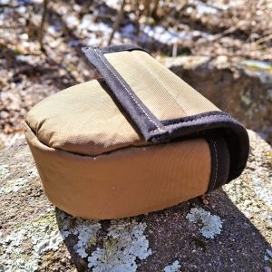 Flylight reel case on a rock and closed