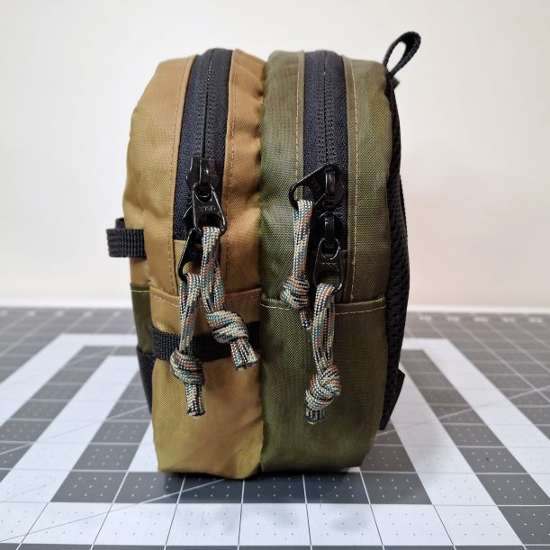 The Truckee Chest Pack features two large compartments with small interior pockets for organization, multiple exterior anchor points, and a rugged construction.